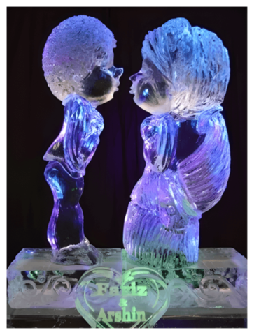 A couple of ice sculptures that are lit up